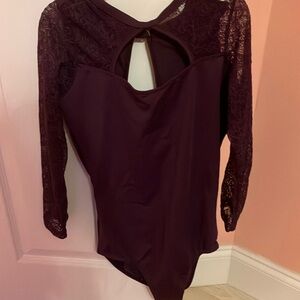 NWOT burgandy lace sleeve dance leotard with open back and jeweled closure.